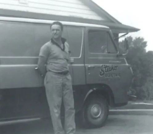 Harold stecho posing by a truck