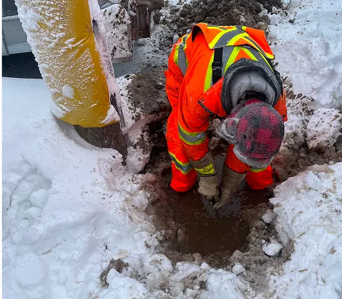 Stecho electrian working outdoors in the snow